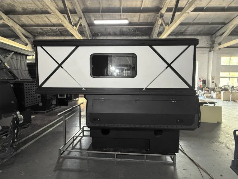 Pickup truck fitted with the TUYU T6 hard-fold pop-top camper with the roof section open